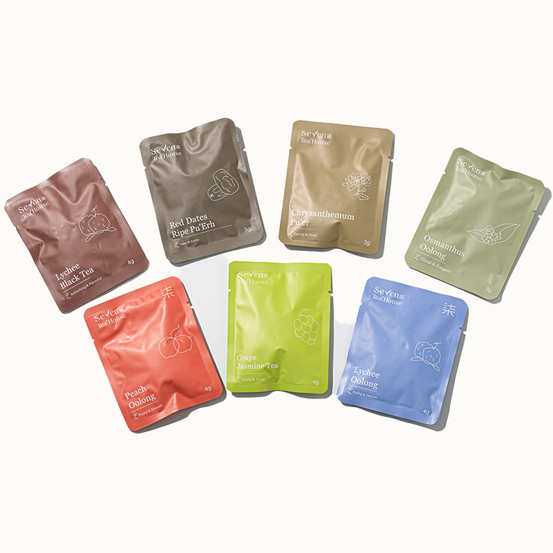 A variety of individually wrapped tea bags in a range of fruity and floral flavors